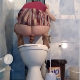 A Russian woman squats over a toilet while taking a piss and a hard, wide shit at the same moment. Vertical format video. About 2 minutes.